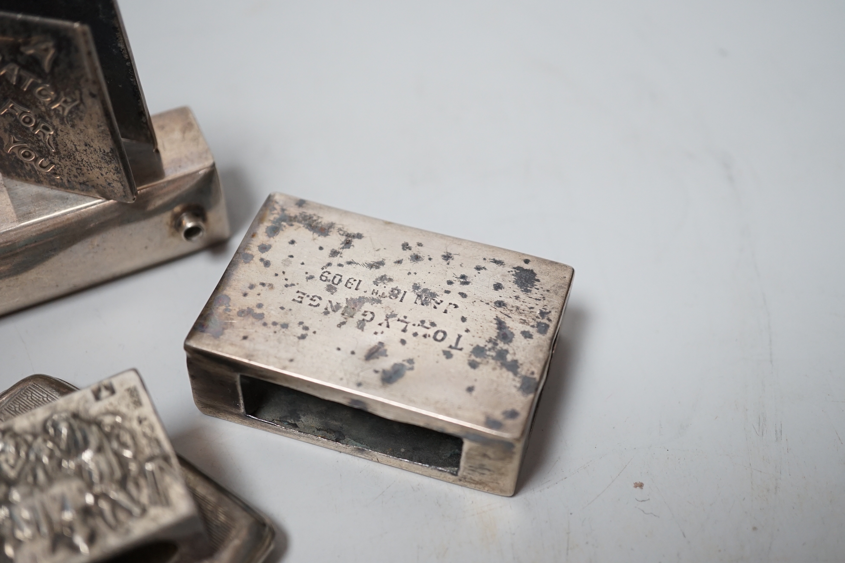 Five assorted mainly early 20th century silver matchbox sleeves and two other items including a matchbook case.